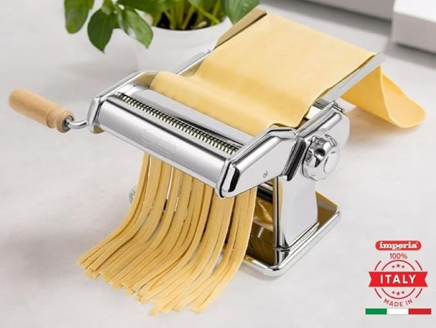 Imperia manual pasta machine on a kitchen counter, showcasing its timeless Italian design.