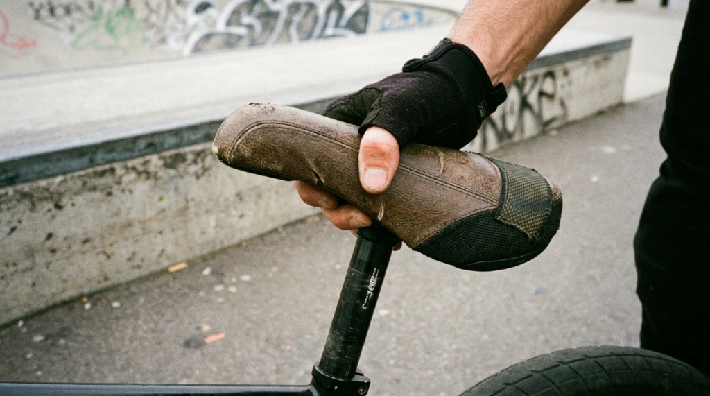 Lightweight plastic BMX racing saddle mounted on carbon race bicycle.